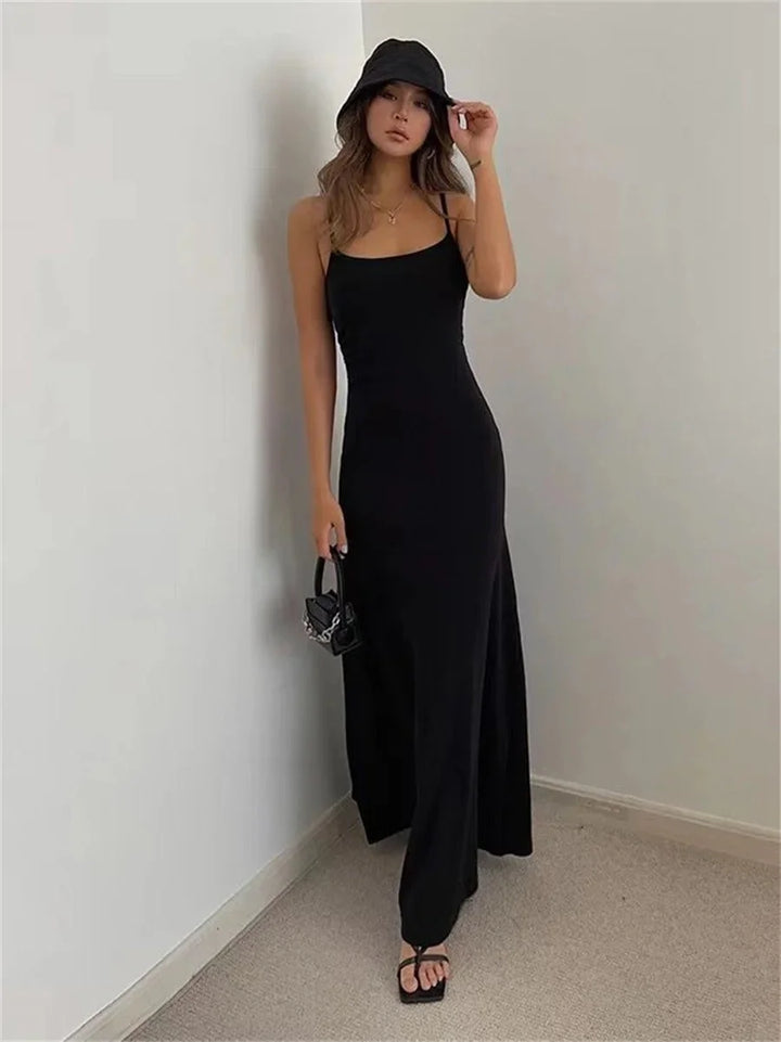 "Sleeveless maxi dress in a slim silhouette, featuring a lightweight and comfortable fabric with a subtle, elegant design."