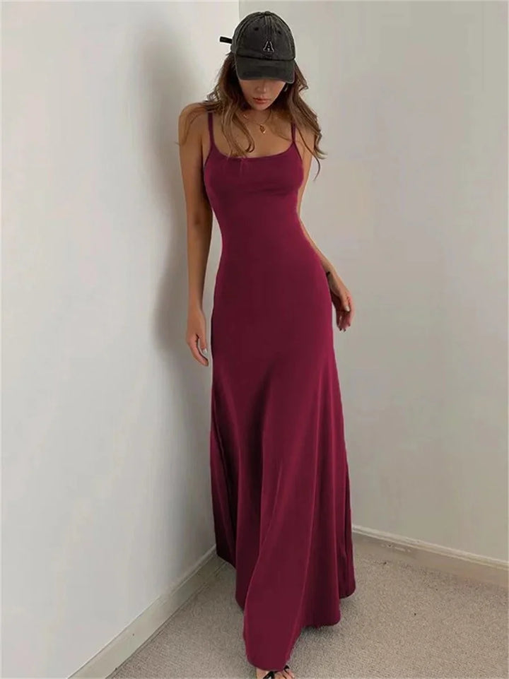 Burgundy Red sleeveless maxi dress with a slim silhouette, perfect for any occasion. Made of soft, flowy fabric with a…