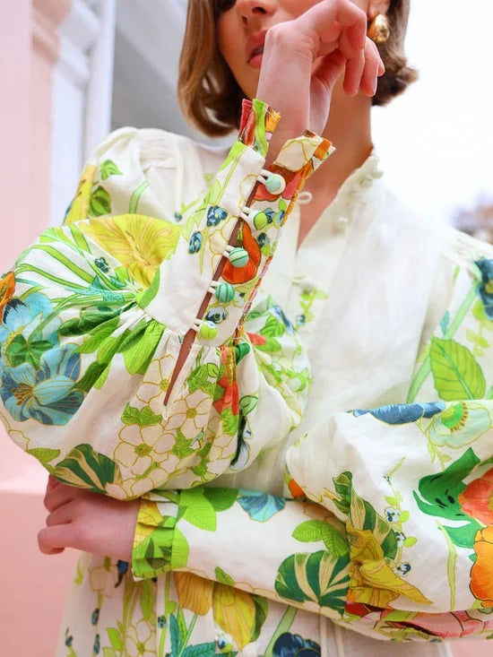 "Flowy maxi shirt dress in floral pattern, made from breathable fabric, perfect for a casual yet elegant look."