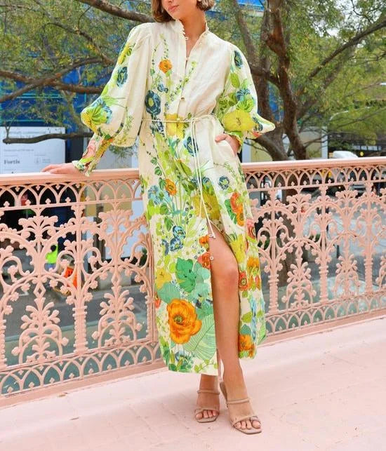 Flowy maxi shirt dress in Kamdyn with a colorful floral pattern on a lightweight, airy fabric.