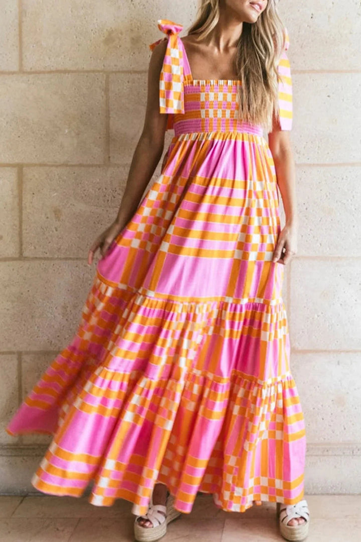 "Renley maxi dress in checkered design with smocked bodice and flowy skirt, ideal for a casual and chic summer look"