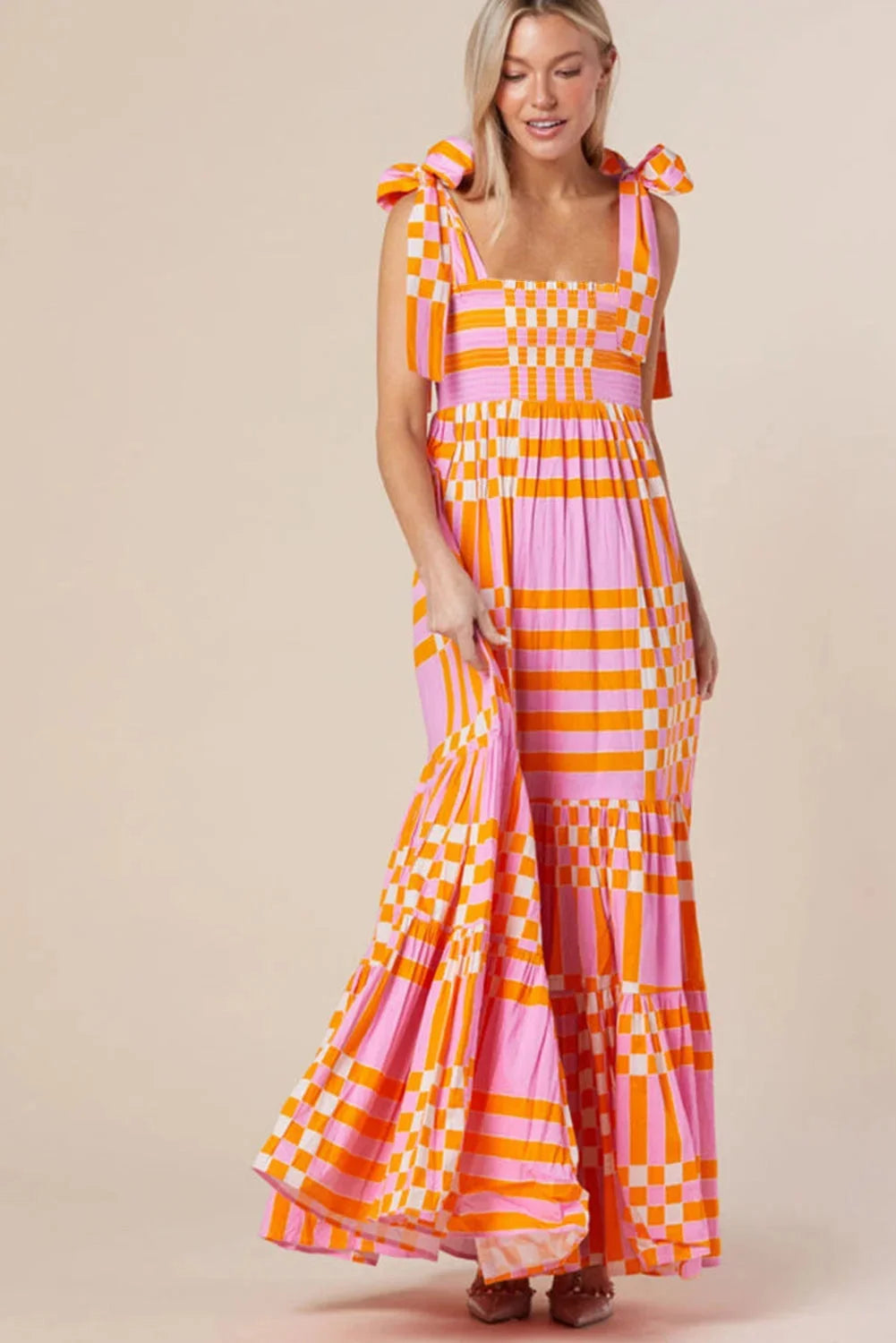 "Renley smocked maxi dress with checkered design, featuring soft cotton fabric and elegant gathers at the waist."