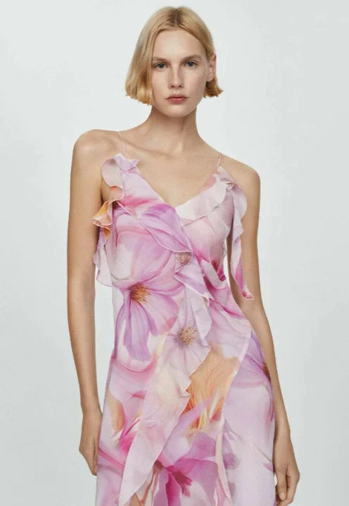 Floral asymmetric dress with ruffles in a lightweight chiffon fabric, featuring a unique and elegant design by Dayla.