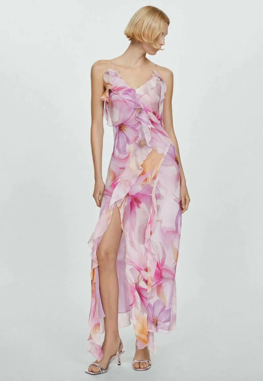 "Floral asymmetric dress with ruffles in soft breathable fabric for a playful and feminine style."