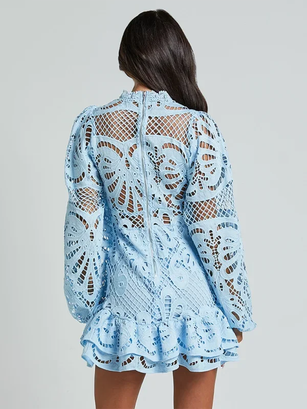 "Fabiola - Long sleeve ruffled lace mini dress in black, featuring intricate lace details and elegant ruffles."