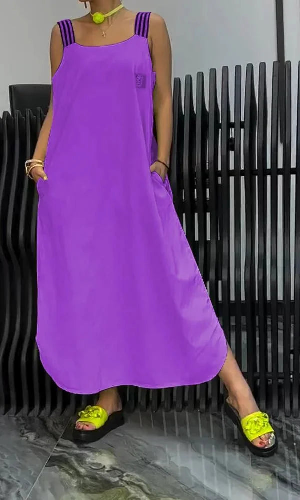 Charity sleeveless relaxed maxi dress in navy blue with side pockets, made of lightweight breathable cotton blend fabric.