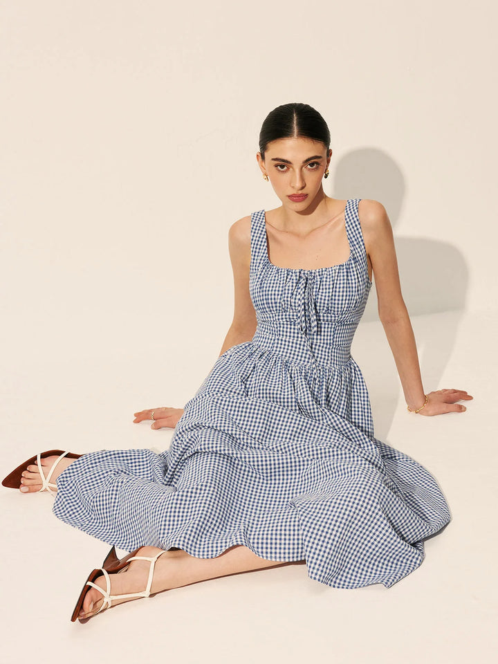 "Navy gingham cotton maxi dress with sleeveless design for a relaxed and stylish look."