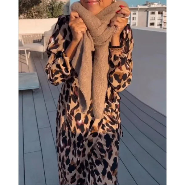 "Brown leopard print wrap dress with long sleeves, made of lightweight and flowy fabric for a stylish and elegant look"