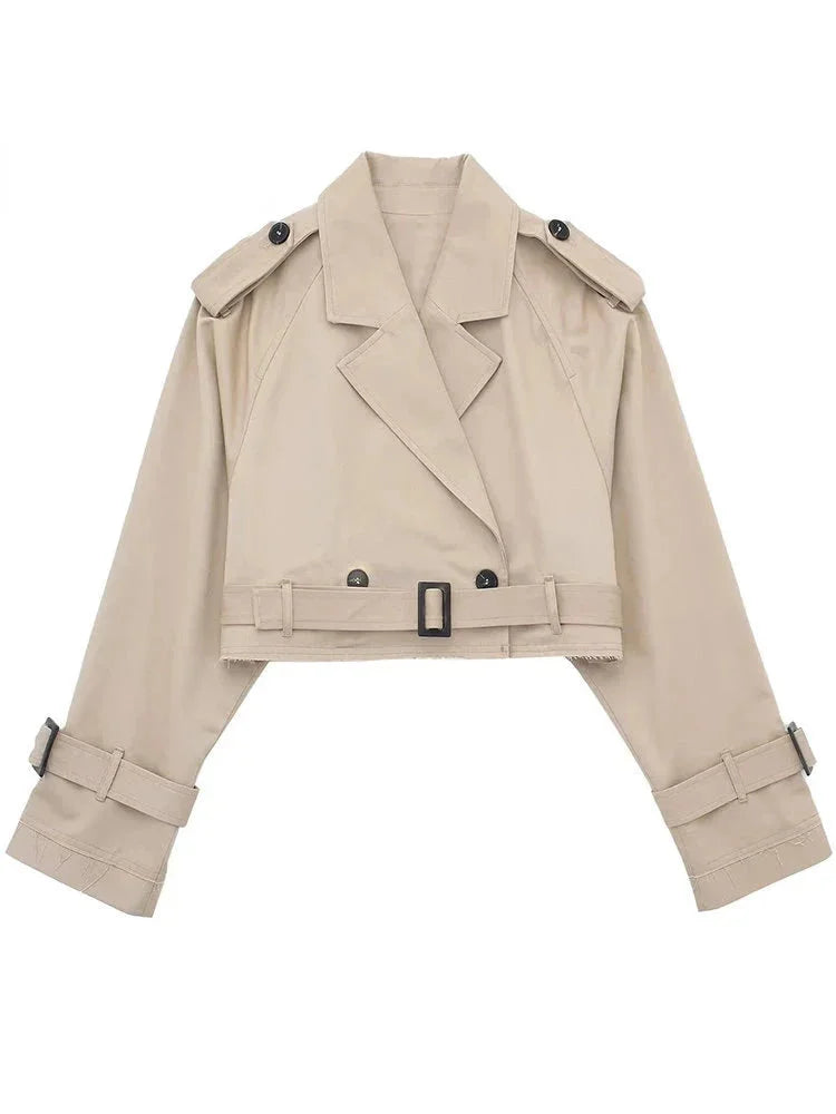 "Beige belted trenchcoat with buckles, a chic cropped silhouette, perfect for any stylish outfit."