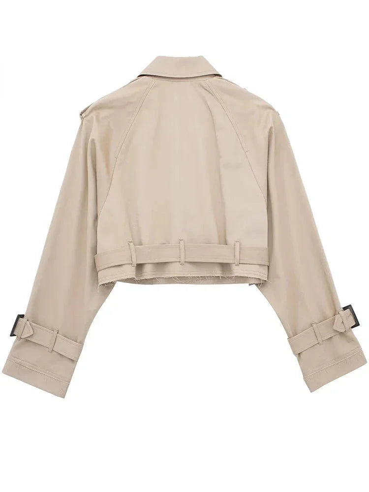 Kaila cropped trenchcoat in classic beige, with chic buckle details and elegant waist tie, perfect for effortlessly…