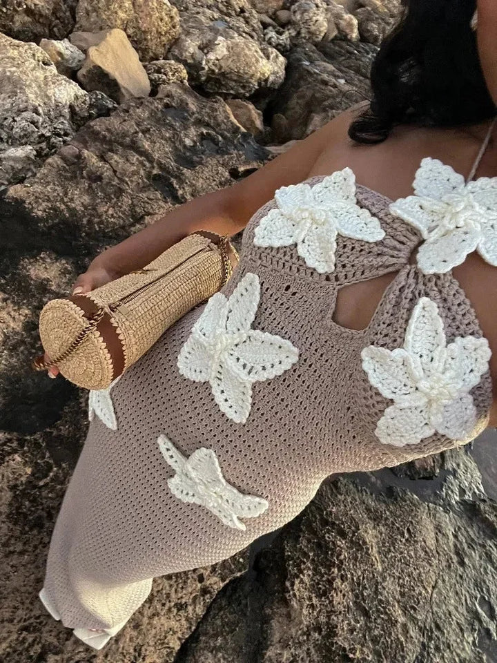 Crochet halter maxi dress with a stunning backless design and intricate detailing by the designer Amori.
