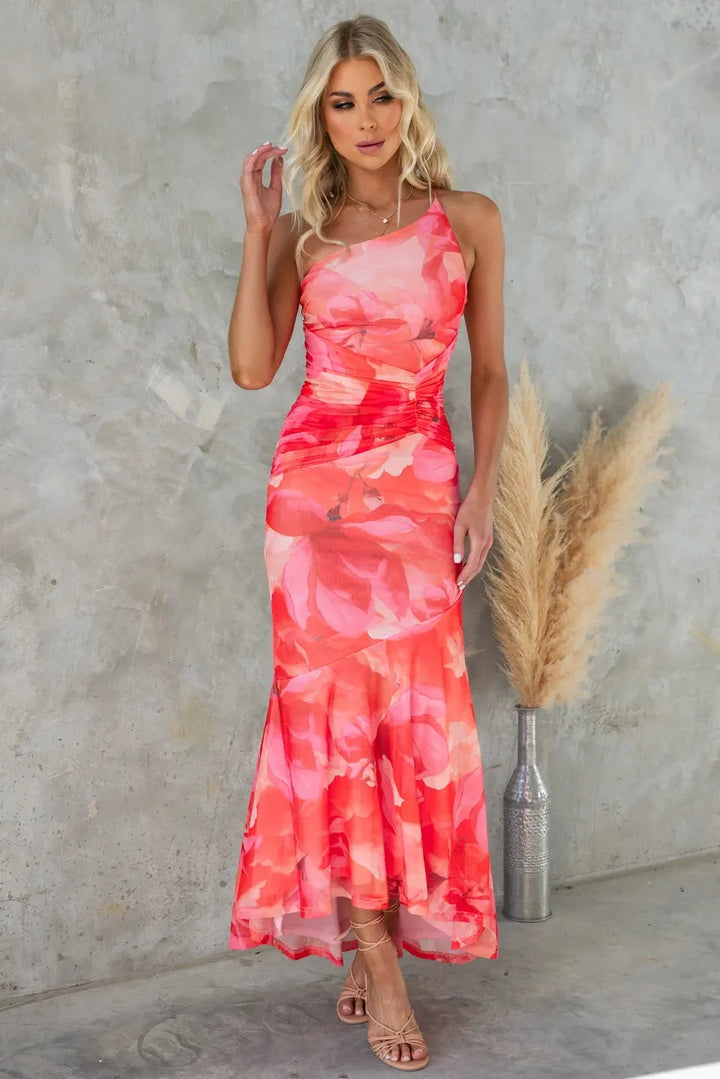 Red strapless midi dress with blue floral pattern, perfect for casual events. Made from comfortable and breathable fabric.