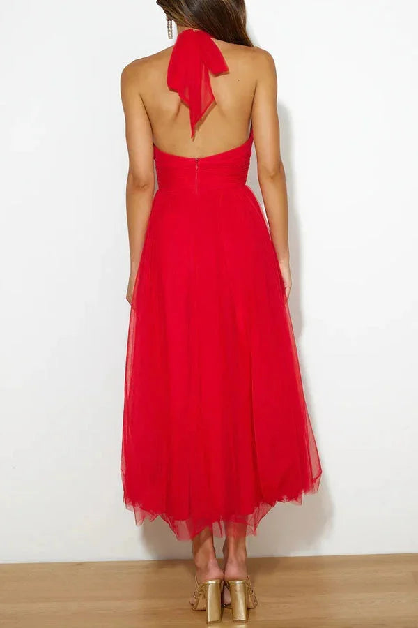 "Kayla halter neck pleated midi dress in soft chiffon fabric with a delicate floral print pattern."