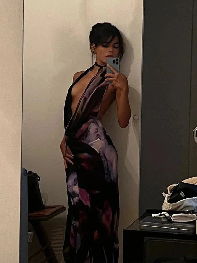 Abstract print halter neck maxi dress in Haislee featuring a flowing silhouette and vibrant colors.