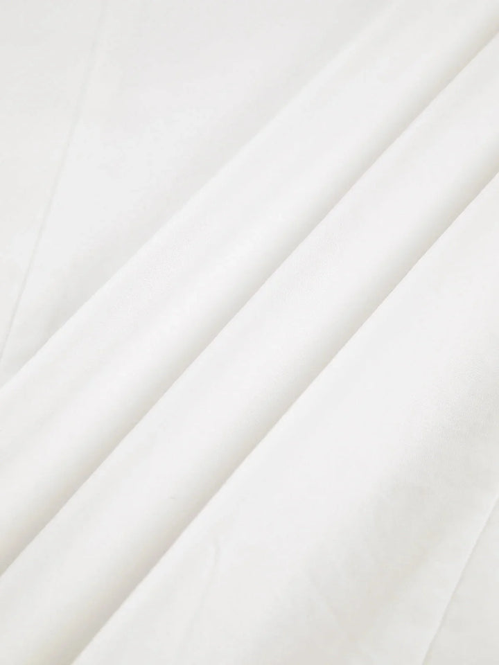 Oversized button-detail shirt by Myra in a chic, relaxed fit design.