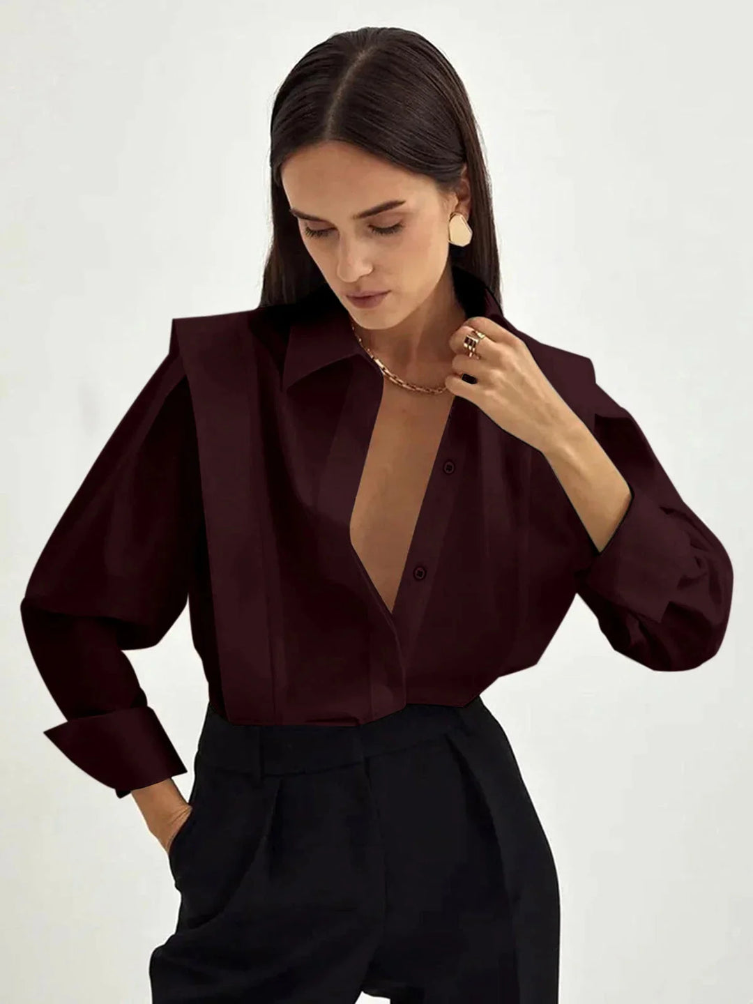 Burgundy oversized shirt with button details, made of soft durable fabric - Myra adds a chic touch to your wardrobe.