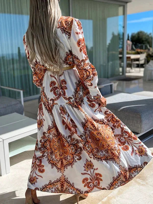 "Elea paisley maxi dress with elegant high slit, featuring intricate paisley pattern on soft, flowing fabric, perfect for a…
