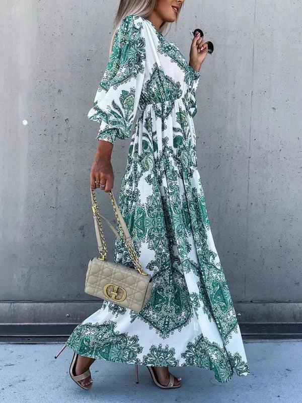 "Elea maxi dress in paisley pattern with high slit, made from flowing fabric for a chic and elegant look"