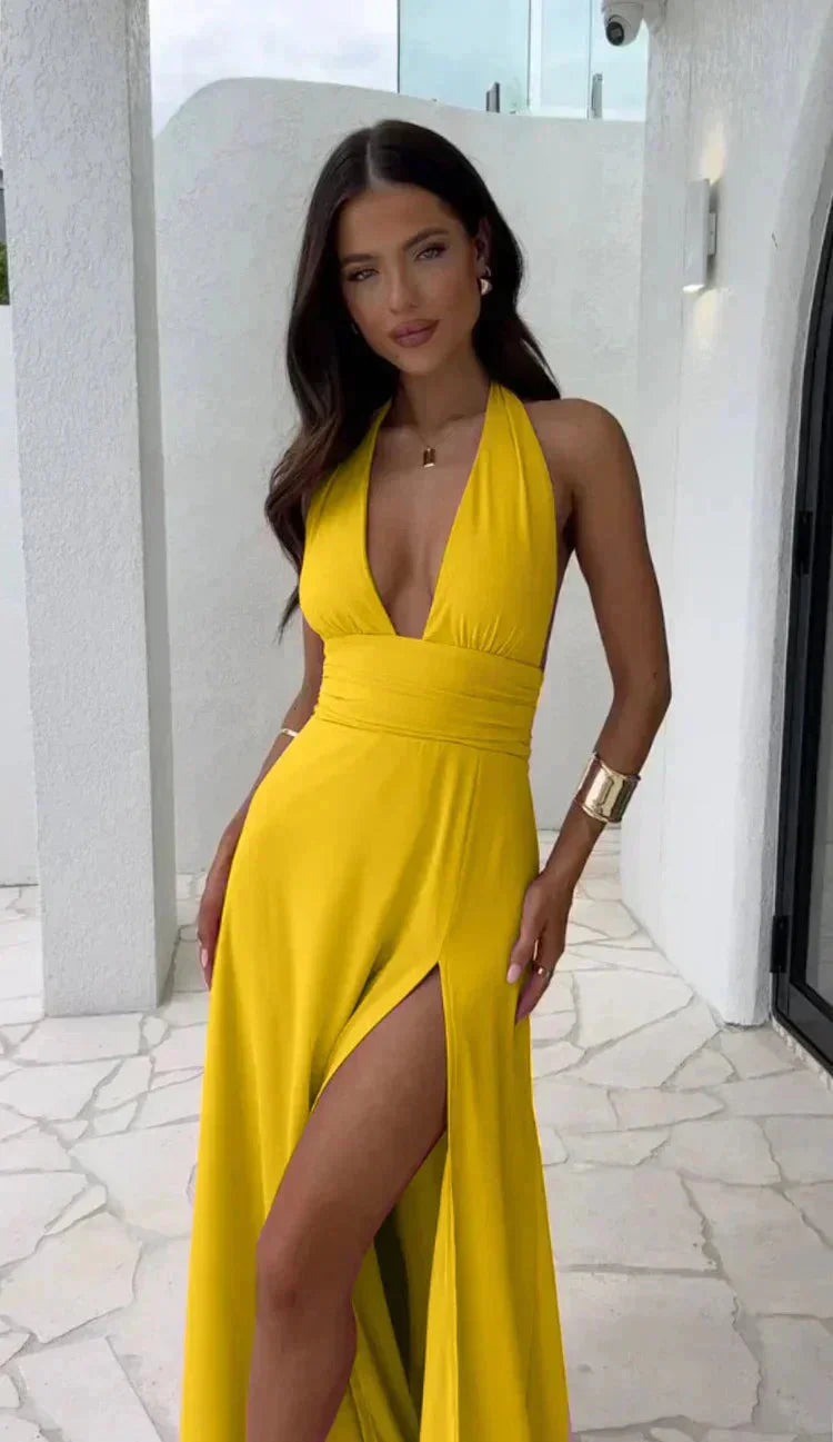 Yellow Keilah dress with plunging neckline and leg slit, made of soft flowing fabric, perfect for a sophisticated and…