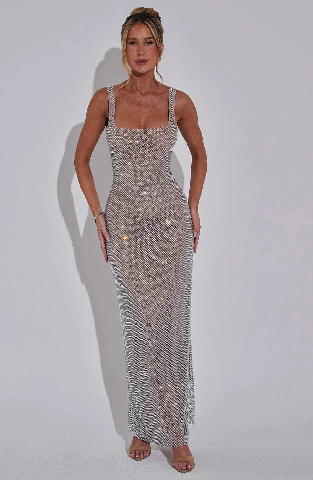 Stormy sleek mesh maxi dress for women, featuring a modern design with a flowy silhouette and delicate mesh fabric.