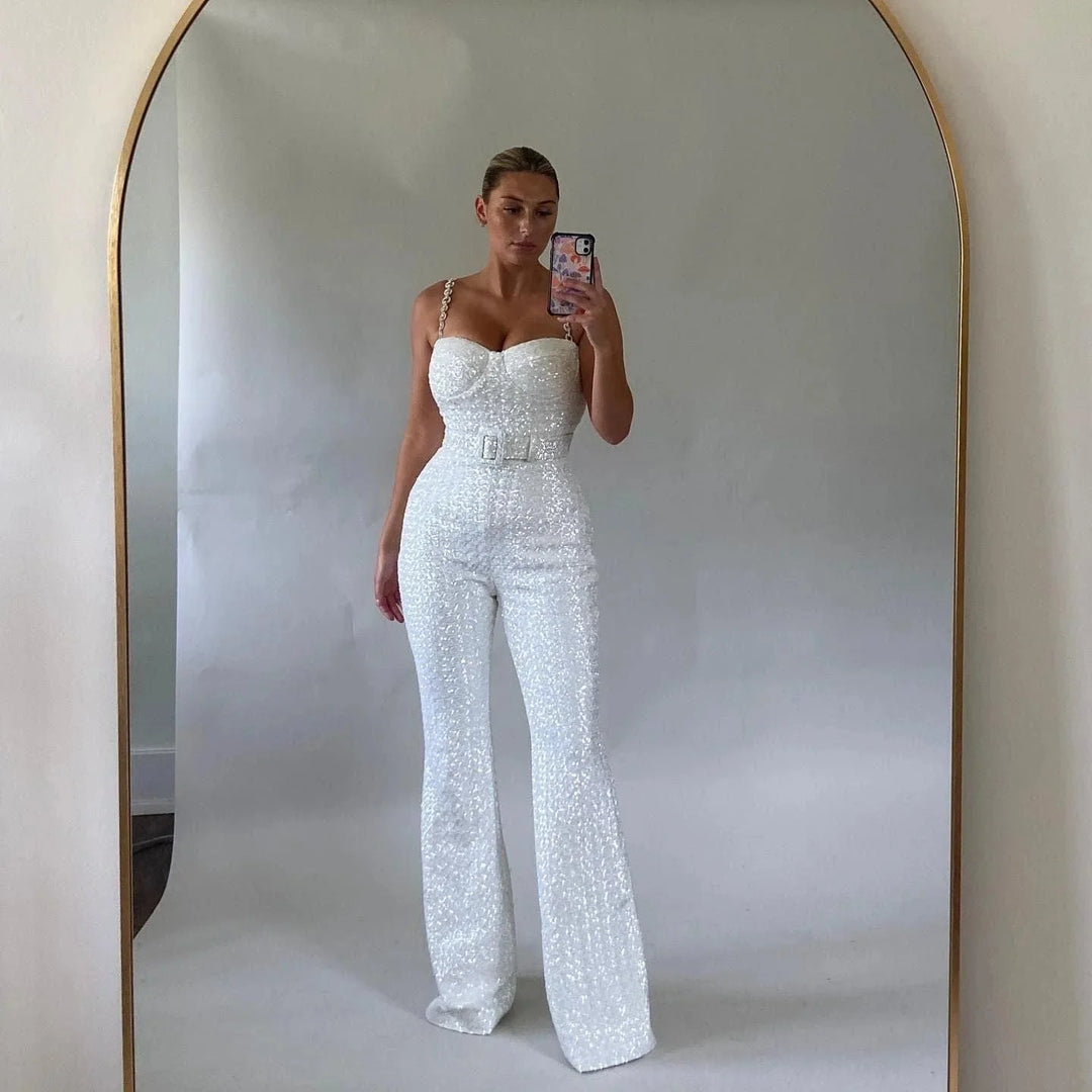 White strapless jumpsuit with shimmering glitter fabric and waist belt detail by Averee.
