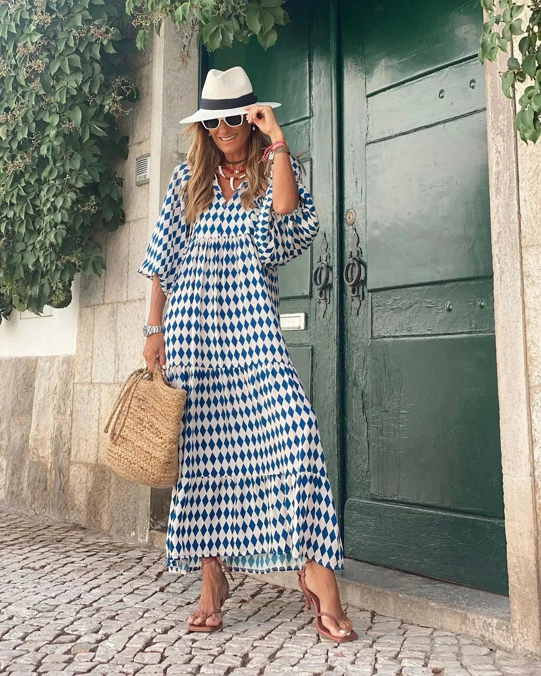 Jenelle maxi dress featuring a playful print design, made of lightweight and breathable fabric perfect for summer days.