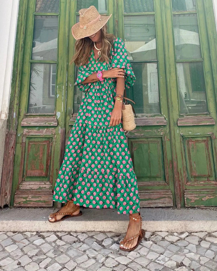 Alt text: "Jenelle maxi dress featuring a vibrant print design, made from lightweight and breathable fabric, perfect for…