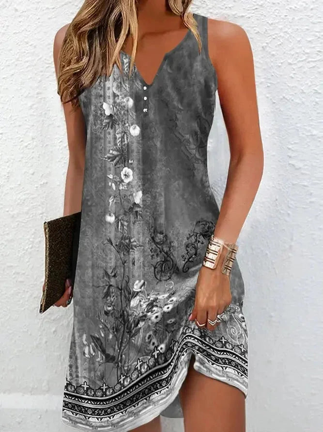 Grey Mariella dress with V-neckline, sleeveless design, and floral pattern. Made from soft and comfortable fabric, perfect for…