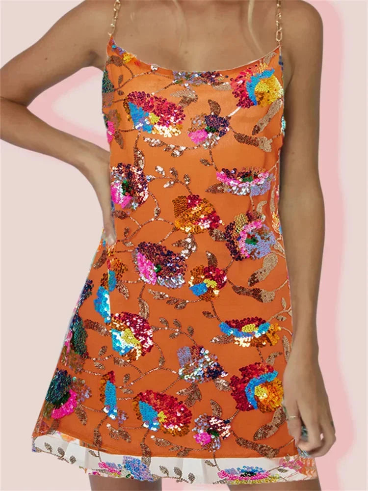 Orange mini dress with vibrant print by Gitty, made with stretchy fabric. Features a sleek design suitable for casual…