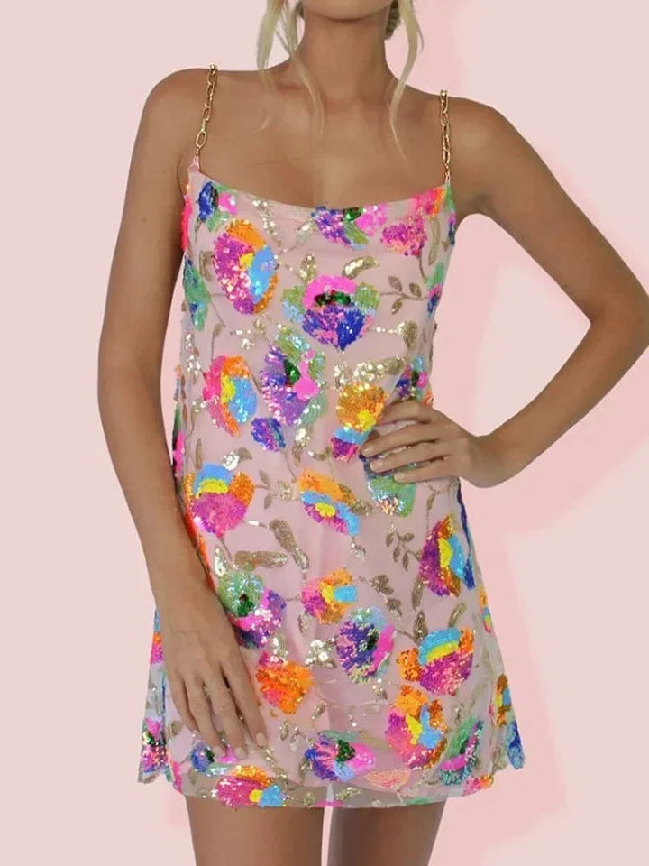 Pink mini dress with vibrant print by Gitty. Features a sleek design and soft, comfortable material perfect for a casual…