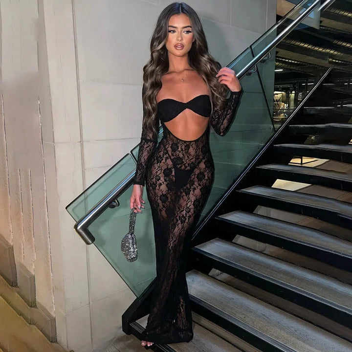 Black lace dress featuring cutouts on long sleeves. Elegant and chic design perfect for formal events.