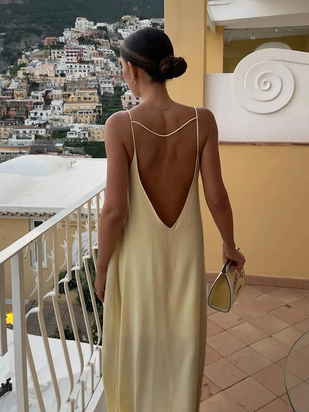 Zylah women's backless maxi dress with sleek straps, made of flowy fabric, perfect for a stylish summer look.