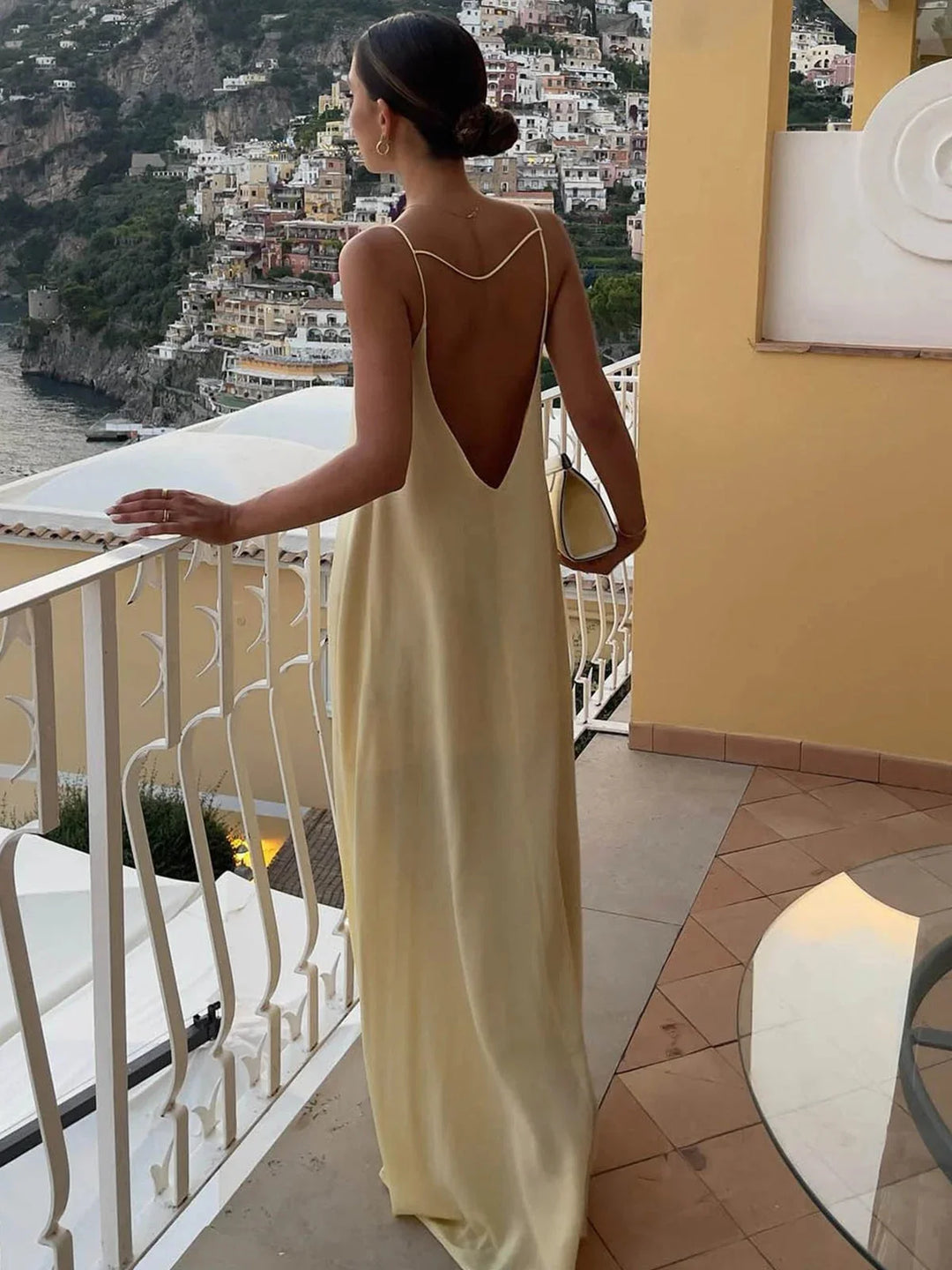 "Zylah backless maxi dress with sleek straps in soft, flowing fabric, perfect for a casual chic summer look."