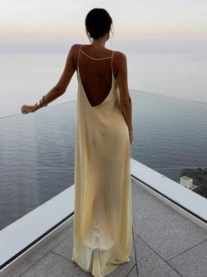 Zylah Women's backless maxi dress featuring sleek straps, made from soft and breathable fabric in a cool and elegant design.