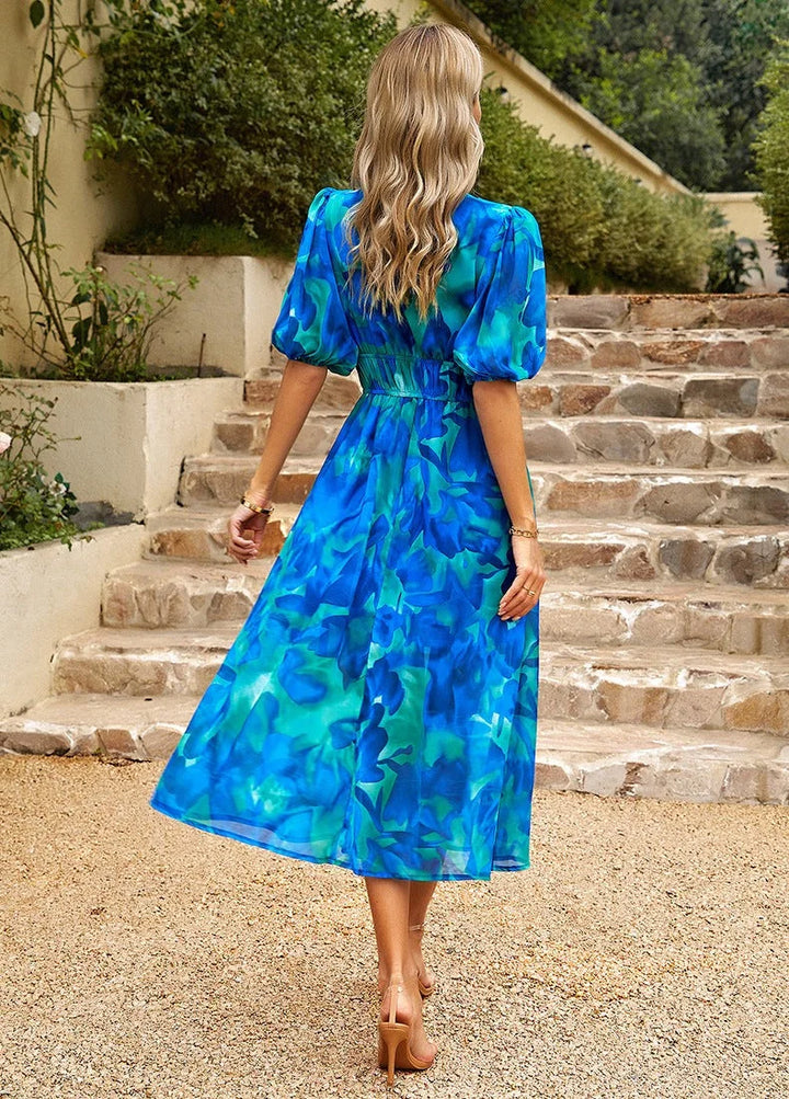 "Nico - Floral midi dress with elastic waist, featuring a soft and breathable material in a charming floral design."