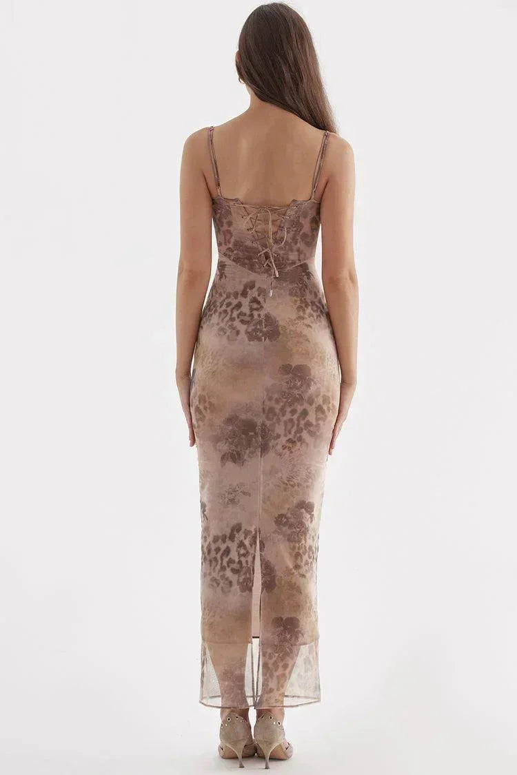 "Stevi floral maxi dress with adjustable straps, featuring a vibrant botanical pattern on a flowy fabric for a comfortable…