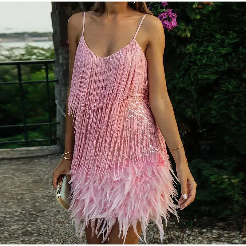 "Feathered mini dress in Pink with adjustable straps and intricate design, made for a stylish look at any event."