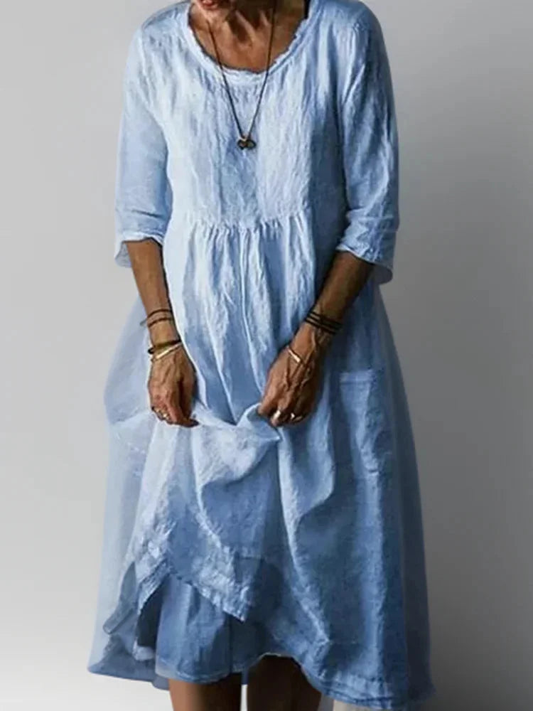 "Eloise - V-neck tiered maxi dress with 3/4 sleeves in soft cotton blend, featuring a relaxed fit and stylish design."
