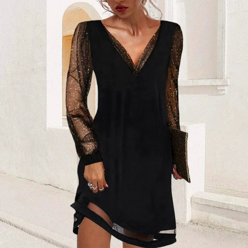 "Aniyah V-neck mini dress features sheer sleeves and a figure-flattering silhouette, perfect for making a chic statement."