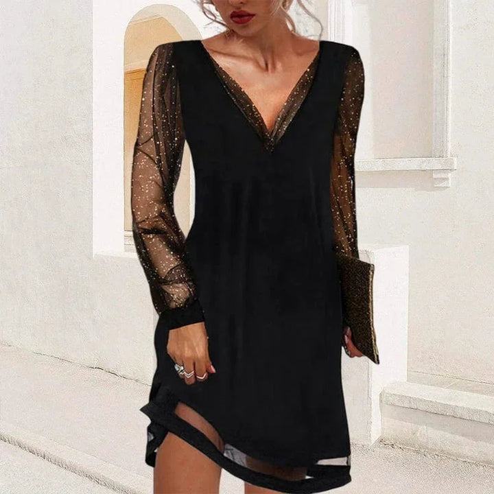 "Aniyah V-neck mini dress features sheer sleeves and a figure-flattering silhouette, perfect for making a chic statement."
