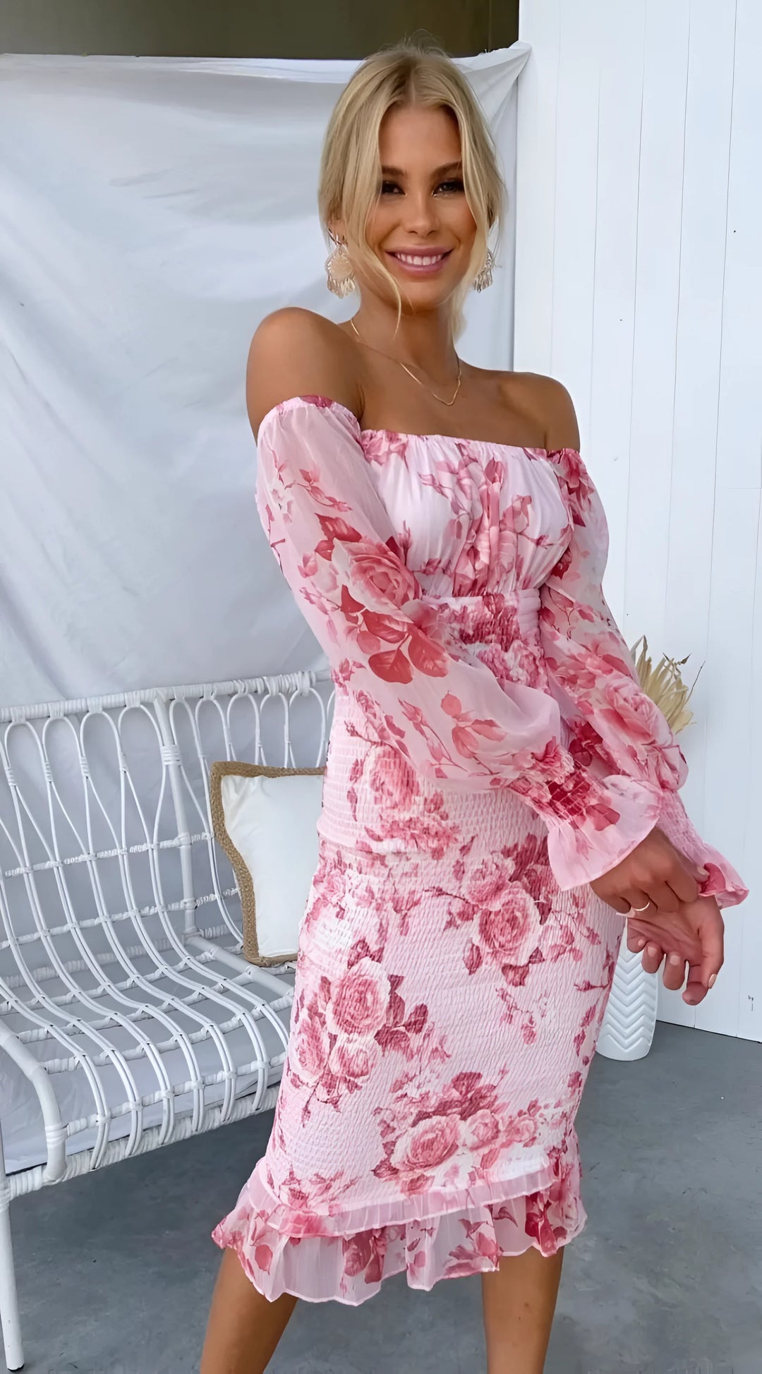 Pink off-shoulder midi dress with ruffles, adorned with floral prints on a soft, flowy fabric - Emry dress.