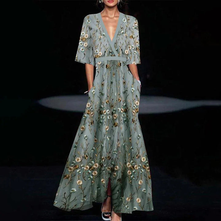 Light blue maxi dress with floral print and half sleeves, made from soft and comfortable fabric.