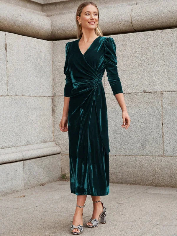 Velvet wrap dress in rich navy hue with statement puffed sleeves and a feminine silhouette by Angeles.