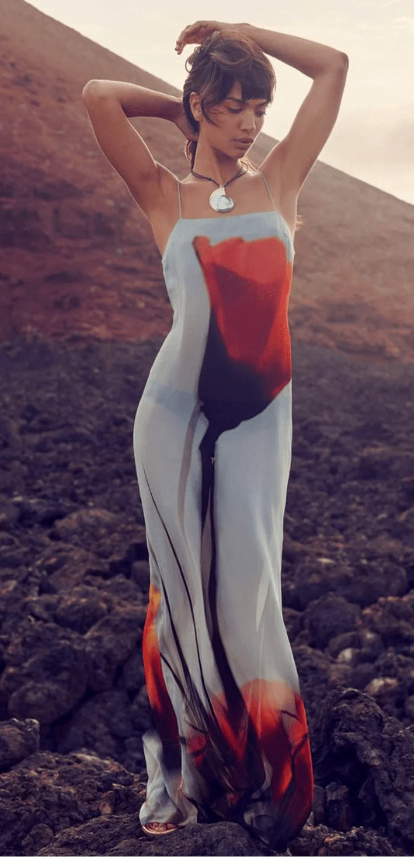 Flowy red and grey abstract maxi dress in a blend of Odessa fabric, perfect for a casual yet stylish look.