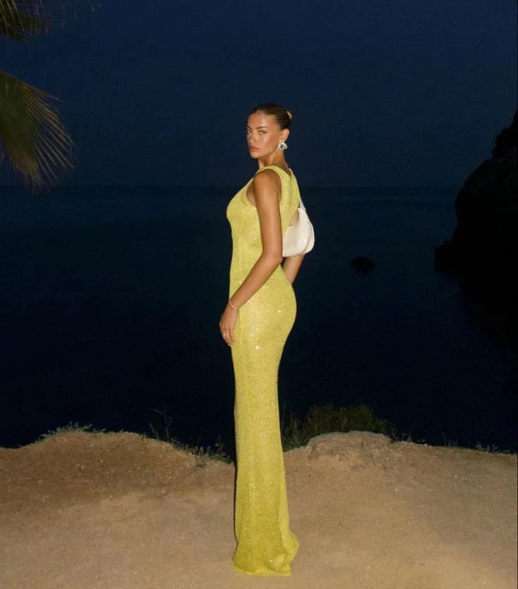 Sleeveless evening dress featuring sparkling sequins on a sleek design by Mylee.