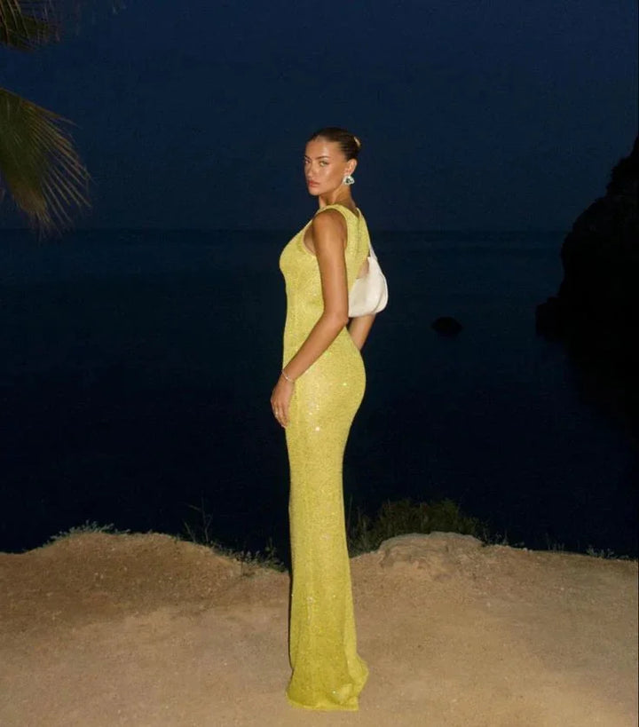 Sleeveless evening dress featuring sparkling sequins on a sleek design by Mylee.