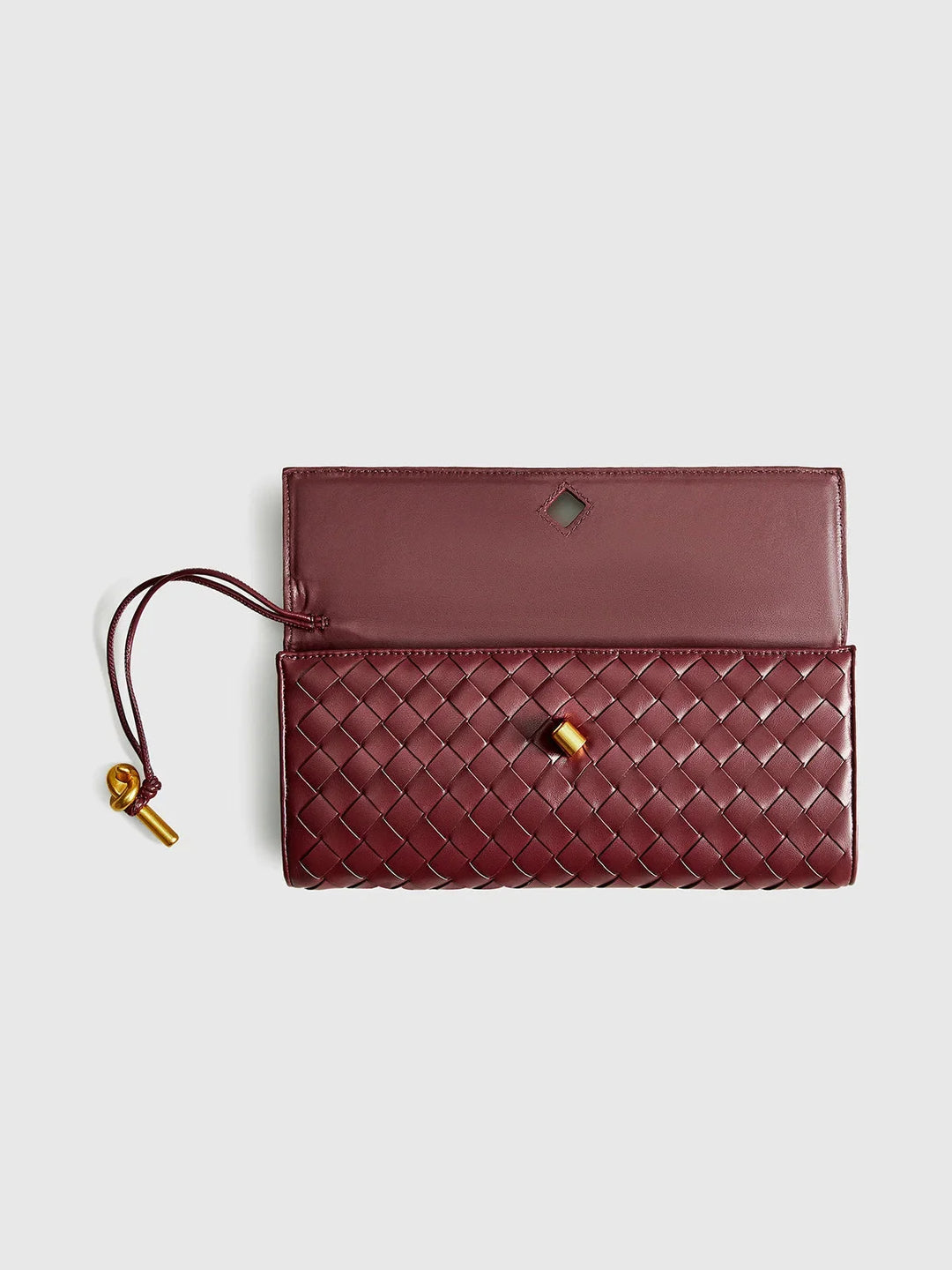 Quilted beige shoulder bag with Tierney accents and secure clasp closure, perfect for everyday elegance.