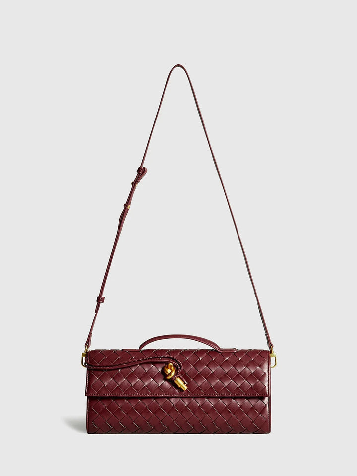 Tierney shoulder bag with quilted detailing, secure clasp, and adjustable strap in taupe color.
