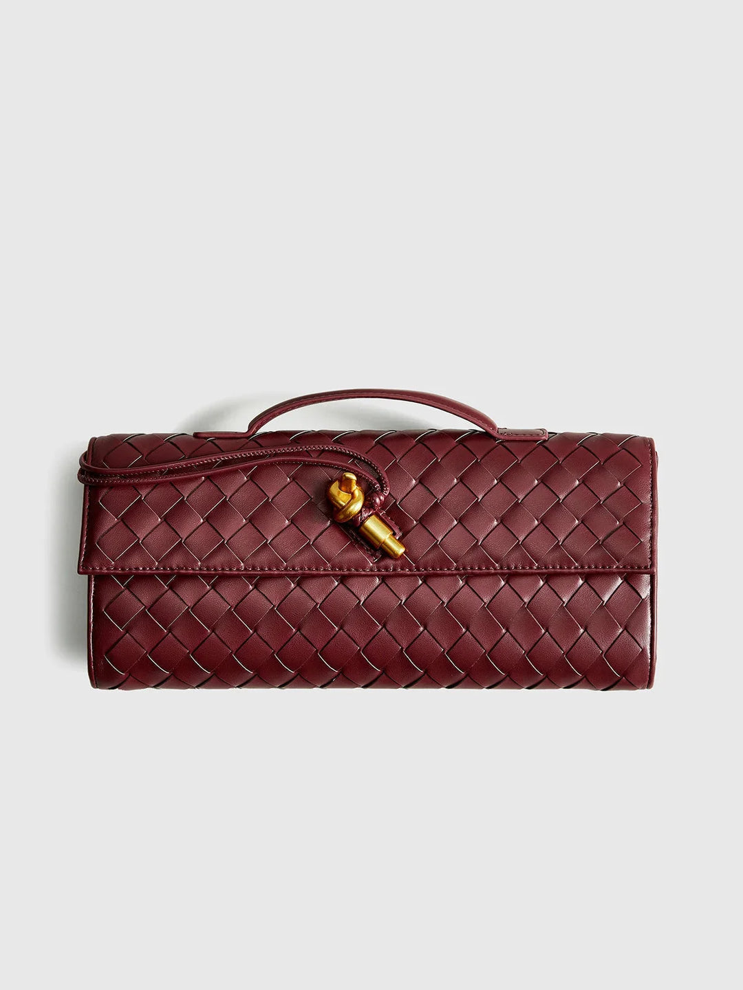 Tierney shoulder bag in quilted design with secure clasp, made of durable material.