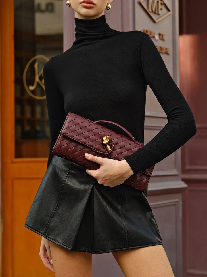 Maroon quilted shoulder bag with secure clasp, showcasing opulent Tierney detailing.
